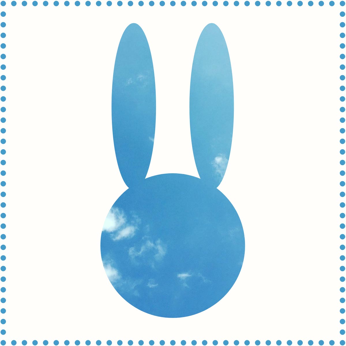 bunny shape cut out from a photo of a blue sky with white clouds